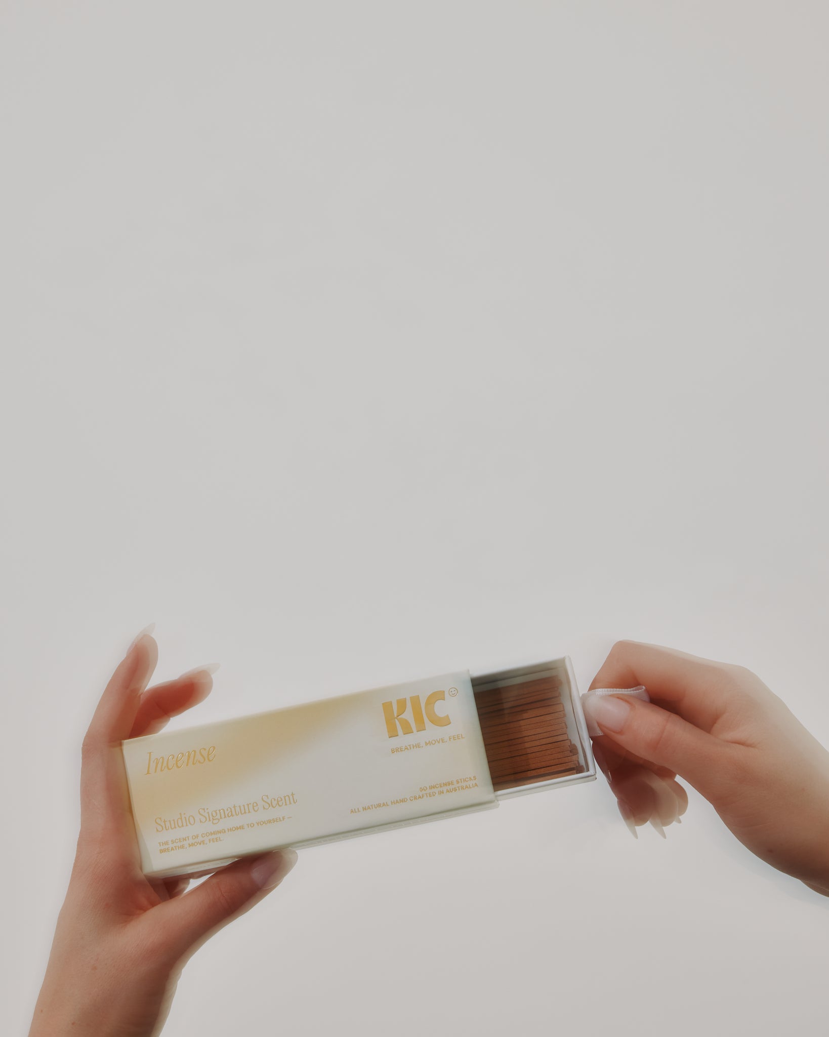 KIC Studio signature Incense in a person's hands. 