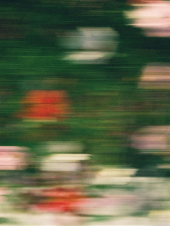 Blurred image of a green background with colorful shapes