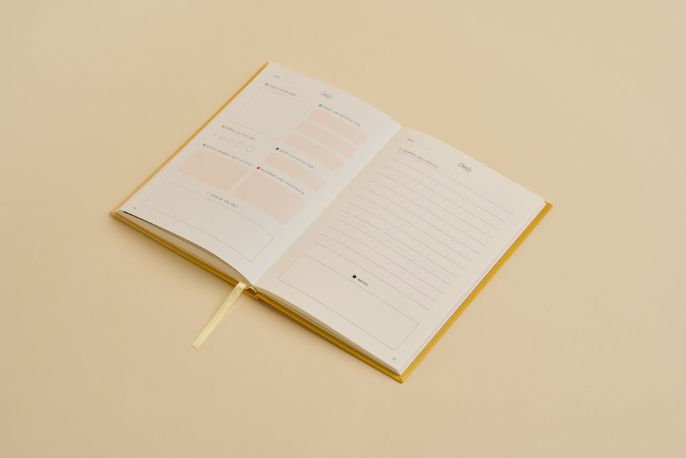 Open notebook with lined pages on a beige background