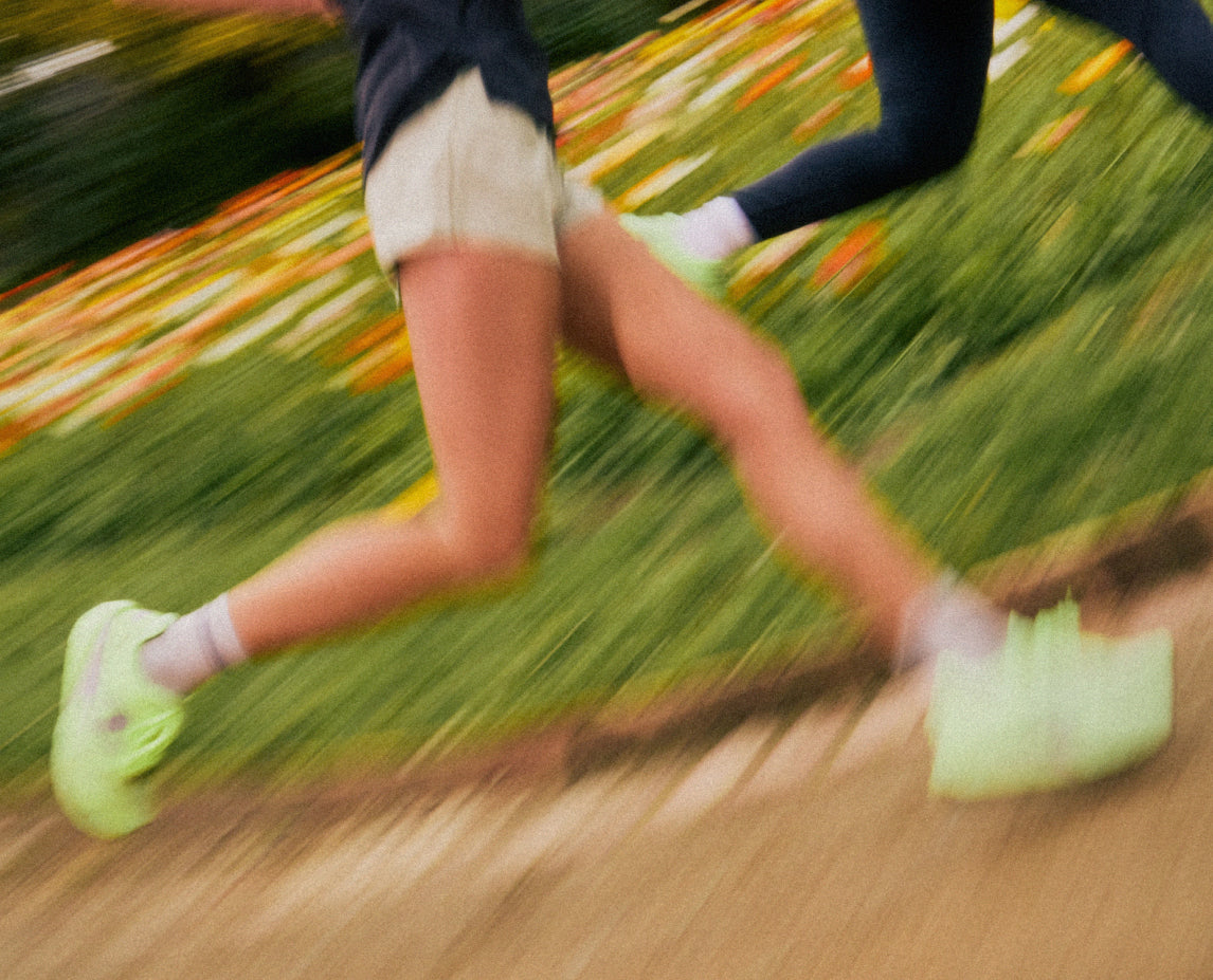 Two people running on a blurred background
